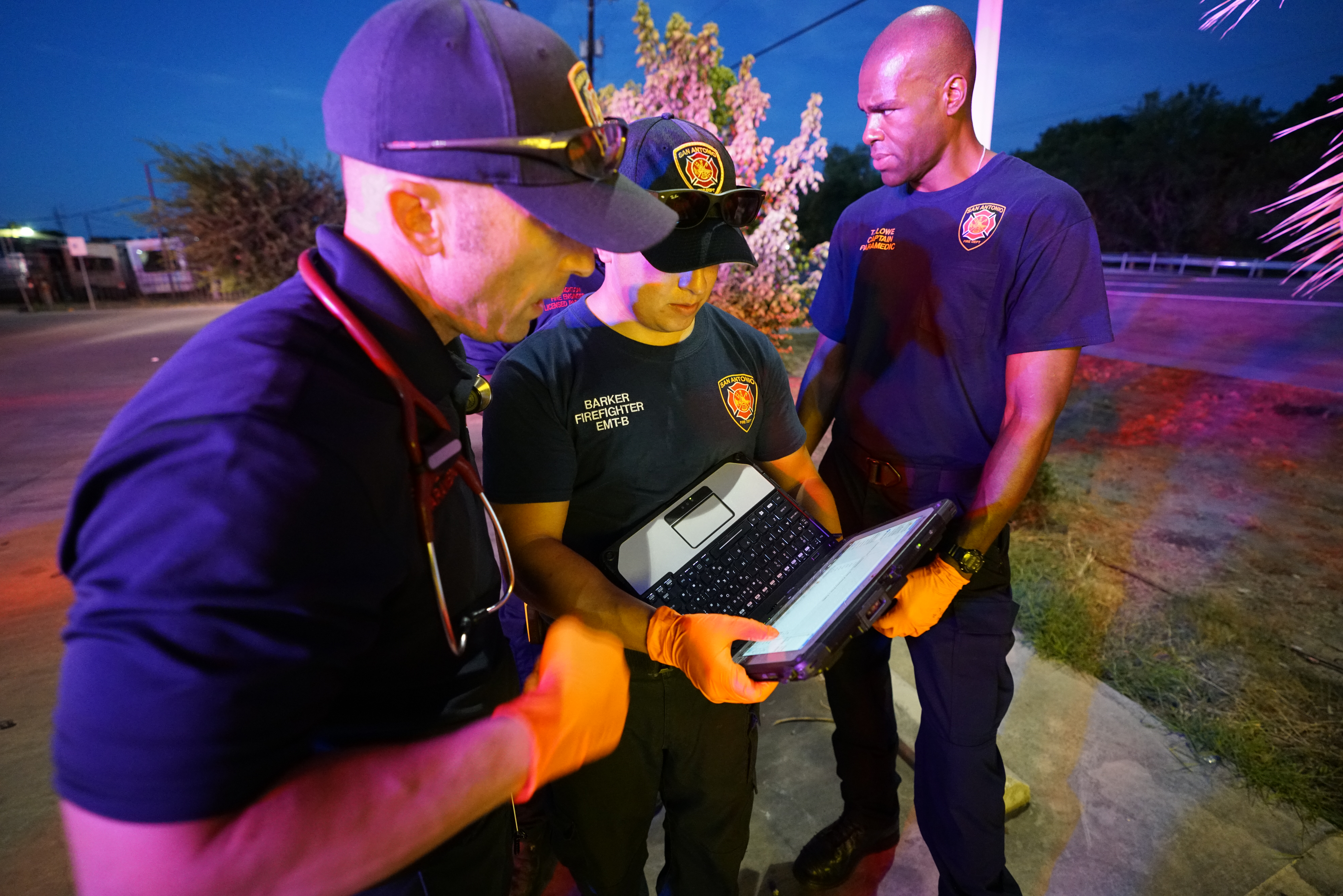 San Fransisco Fire Department Team Looking At Laptop