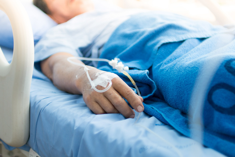 Patient In Hospital Bed